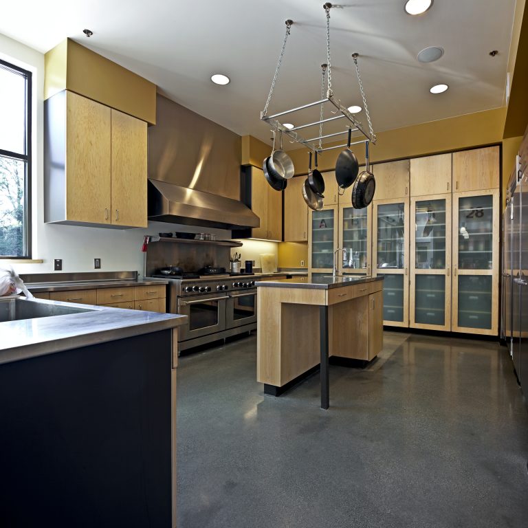 Modern kitchen with custom wood cabinetry and durable quartz countertops.